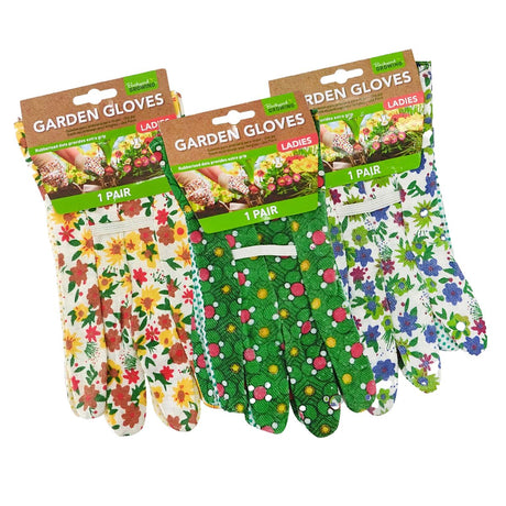 Three pairs of floral gardening gloves in brown paper packaging, displayed side by side on a white background. The left pair has a white background with red, yellow, and orange flowers; the middle pair is green with pink, yellow, and white flowers; the right pair is white with blue, pink, and green flowers.